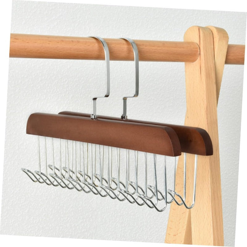 Porte-ceintures en bois et inox présenté comme organisateur de dressing