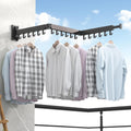 Étendoir mural pliable Séchovia déployé pour sécher du linge